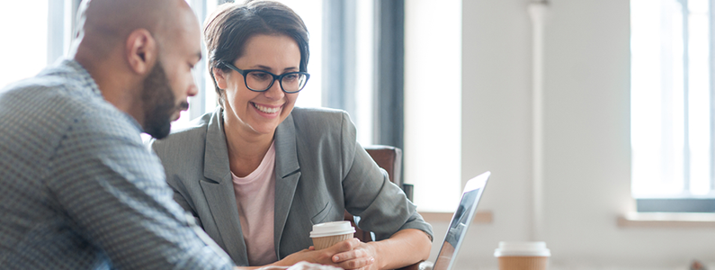 Business person helping on laptop